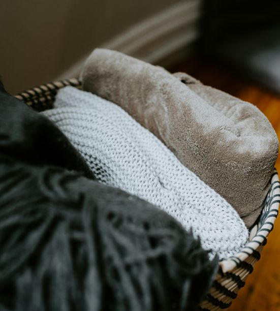 Friendly greeters welcoming visitors at the church entrance with warm smiles