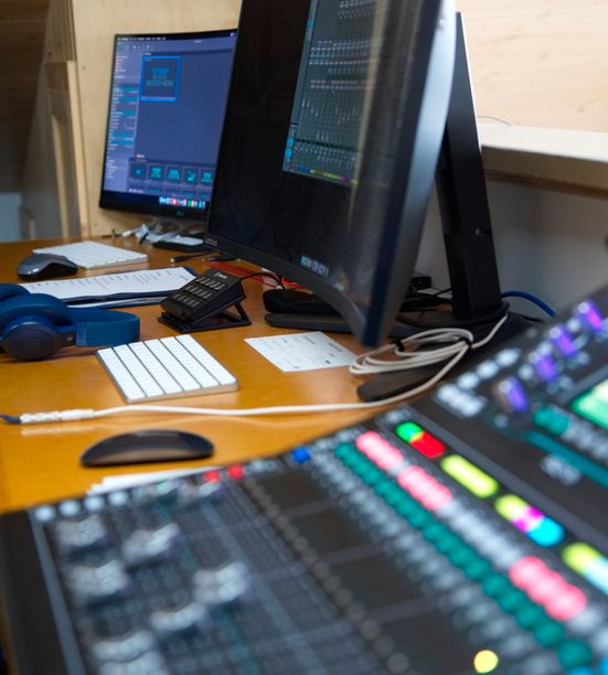 Church technical team operating audio-visual equipment during a worship service